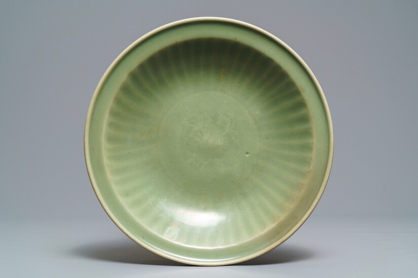 A Chinese Longquan celadon dish with underglaze design, Ming