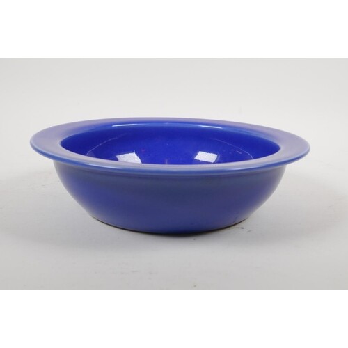 A Chinese blue glazed porcelain bowl with white enamelled bi...