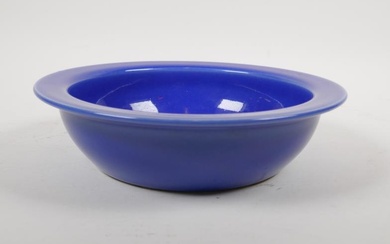 A Chinese blue glazed porcelain bowl with white enamelled...
