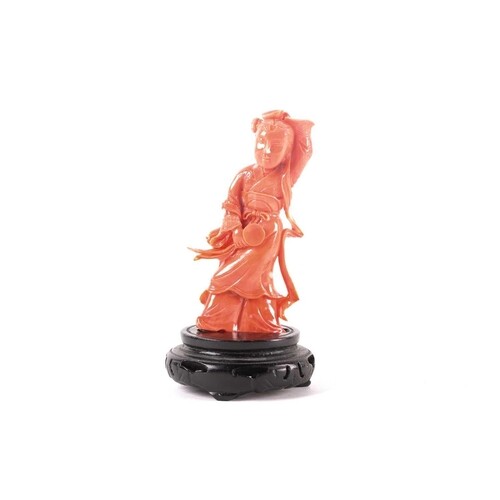A Chinese carved coral figure of Lan Caihe, 20th century, ca...