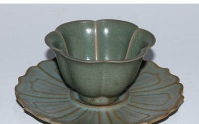 A Chinese celadon lotus wine cup and stand, the saucer 14cm ...