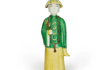 A Chinese famille verte biscuit figure of a young scholar Qing dynasty,...