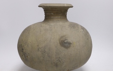 A Chinese grey pottery 'cocoon' jar, Han dynasty, 27cm...
