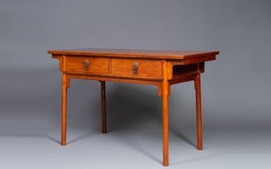 A Chinese huanghuali wooden two-drawer recessed-leg table, 19/20th C.