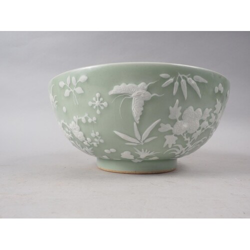 A Chinese porcelain celadon glazed bowl, decorated in high r...