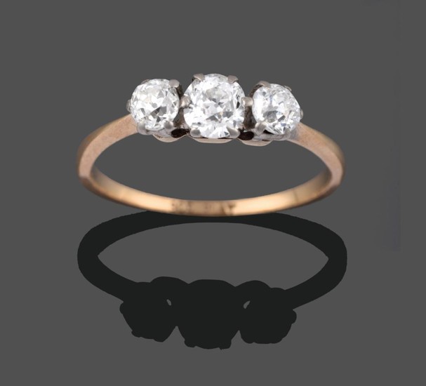 A Diamond Three Stone Ring, the graduated old cut diamonds...