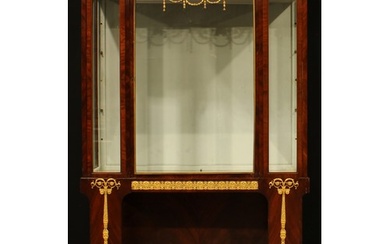 A French Empire Revival gilt metal mounted mahogany display ...