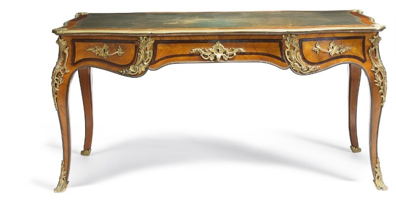 A French Rococo style rosewood and bronze mounted bureau plat, the top inset with green gilt tooled leather. 19th century. H. 74 cm. L. 174 cm. W. 80 cm.