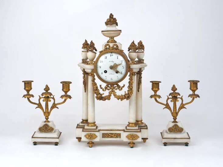 A French gilt-bronze mounted marble clock garniture, late 19th century, the dial signed Le Roy, the case with four columns supporting flowering urn finials on a breakfront base, 45cm high; together with a pair of twin-light candelabra en suite...