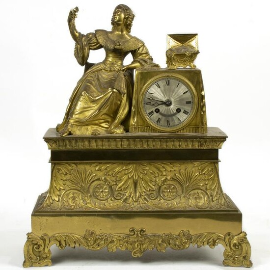 A French gilt bronze statue clock, the seated female