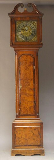 A George III and later mahogany eight day longcase clock, the broken swan neck pediment above brass dial with silvered chapter ring set with Roman numerals, inscribed 'Nicholson Whithaven' above date aperture, above crossbanded door flanked by...