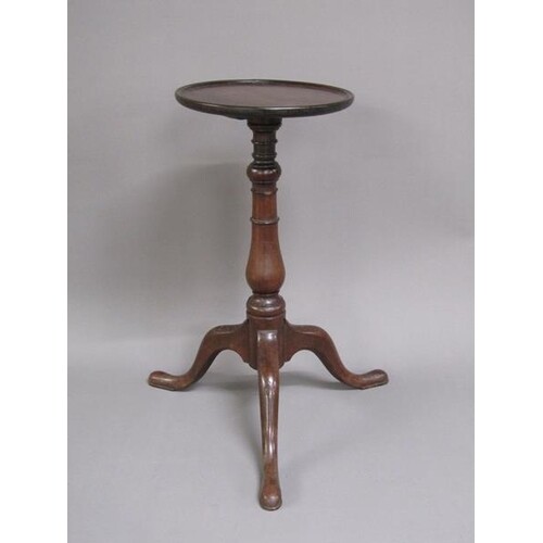 A George III mahogany kettle stand of circular dish form sup...