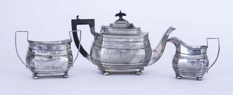 A George V Silver Rectangular Three-piece Tea Service, by...