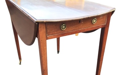 A Georgian mahogany pembroke table with oval moulded top and...