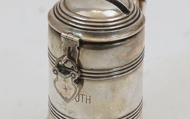 A German novelty money box, 20th century, stamped 800, in the form of a tankard, with slit to lid and later white metal lock, no key, engraved Weihnachten 1902 Von der Urgrofsmutter to base and Helmuth to body, approx. 9cm high, weight without lock...