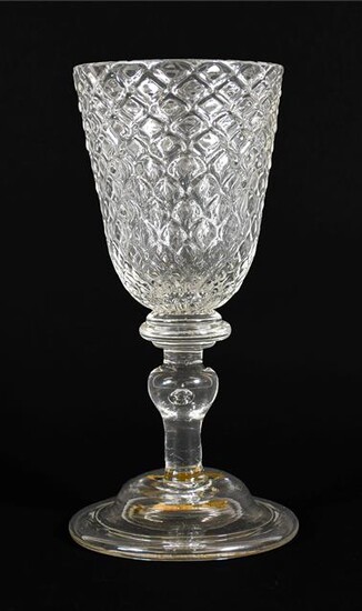 A Glass Goblet, circa 1730, the rounded funnel bowl moulded with ''Nipt diamond waies'' on a triple