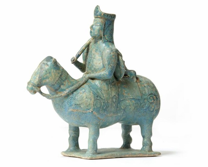A KASHAN UNDERGLAZE DECORATED FIGURE OF A HORSE AND