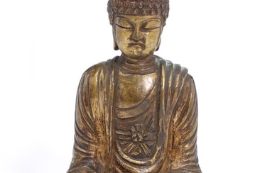 A Korean bronze figure of Buddha seated in padmasana in a loose...