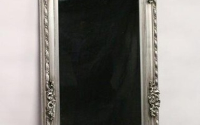 A LARGE WALL MIRROR, with moulded silver coloured