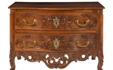 A Louis XV Provincial Carved Walnut Commode