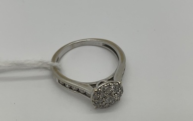 A Modern 18ct White Gold Diamond Cluster Ring, set throughou...