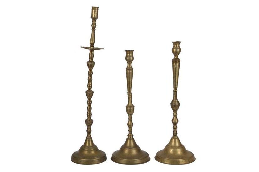 A Near Pair of Brass Candlesticks and an Individual Tall Candlestick Ottoman Provinces, 19th century