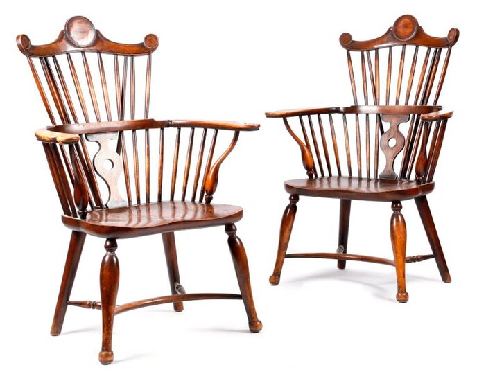 A PAIR OF ARTS AND CRAFTS BEECH AND ELM WINDSOR STYLE ARMCHAIRS LATE 19TH / EARLY 20TH CENTURY each with a rondel decorated comb top rail, above a stick and pierced splat back (2)
