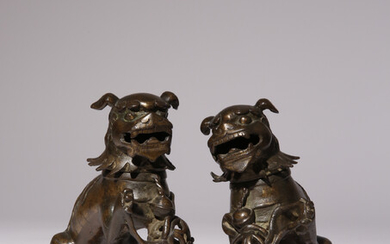 A PAIR OF CHINESE PARCEL-GILT BRONZE 'LION DOG' INCENSE BURNERS AND COVERS