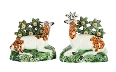 A PAIR OF ENGLISH PEARLWARE BOCAGE GROUPS OF A RECUMBANT STAG AND DOE