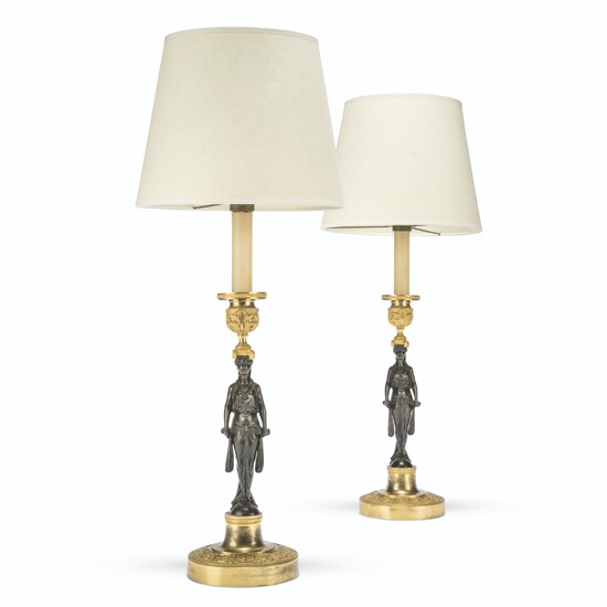 A PAIR OF NORTH EUROPEAN GILT AND PATINATED-BRONZE CANDLESTICKS MOUNTED AS LAMPS