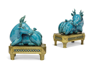A PAIR OF ORMOLU-MOUNTED CHINESE TURQUOISE-GLAZED BISCUIT MODELS OF RECUMBENT DEER, KANGXI PERIOD (1662-1722), THE ORMOLU 19TH CENTURY
