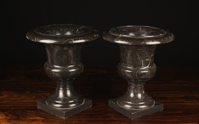 A Pair of Similar 19th Century Turned Black Marble Campana Urns on square bases 10'' (25.5 cm) high