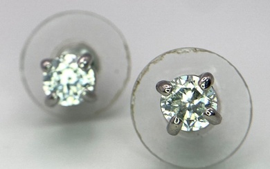 A Pair of White CZ Stone Stud Earrings.