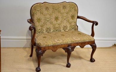 A GEORGE III style walnut settee, early 20th century with...