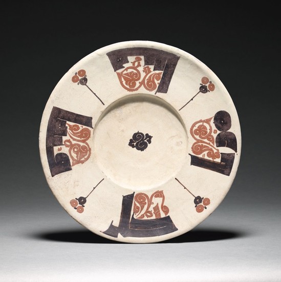 A RARE BICHROME CALLIGRAPHIC POTTERY DISH, NISHAPUR OR SAMARQAND, 10TH CENTURY