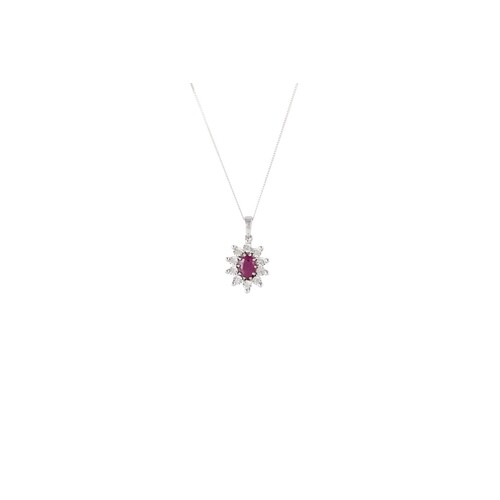 A RUBY AND DIAMOND PENDANT, mounted in 9ct white gold, on tr...