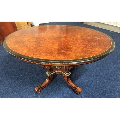 A Regency period oval tilt top dining table with birds eye m...