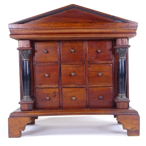 A Regency style mahogany table-top chest of drawers, late 20...