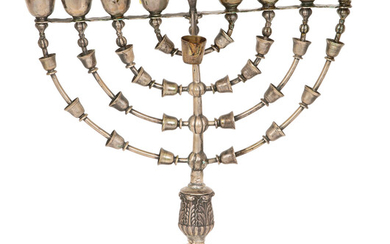 A SILVER HANNUKAH LAMP MODELED AFTER THE MENORAH IN THE TEMPLE IN JERUSALEM
