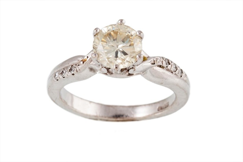 A SOLITAIRE DIAMOND RING, the brilliant cut diamond weighing...