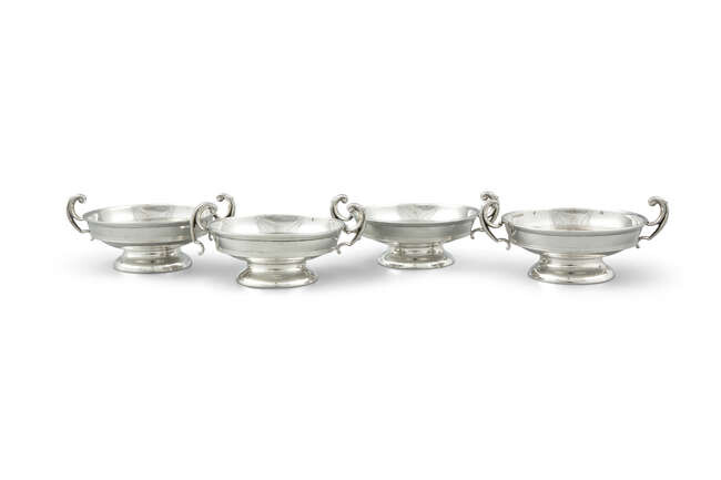 A SUITE OF FOUR SILVER SHALLOW URN SHAPED...