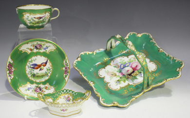 A Sèvres style cabinet cup and saucer, early 20th century, decorated with panels of exotic bird