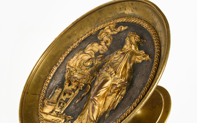 A TAZZA, 1870/80's, classicising motif of a woman next to a burning urn, gilt brass and bronze, Empire style.