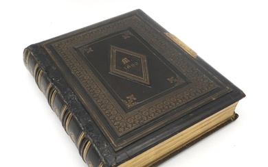 A Victorian leatherbound photograph album, containing portra...