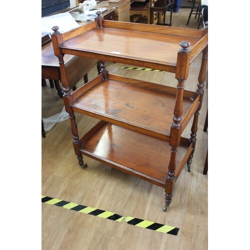 A Victorian mahogany three tier buffet with turned supports,...