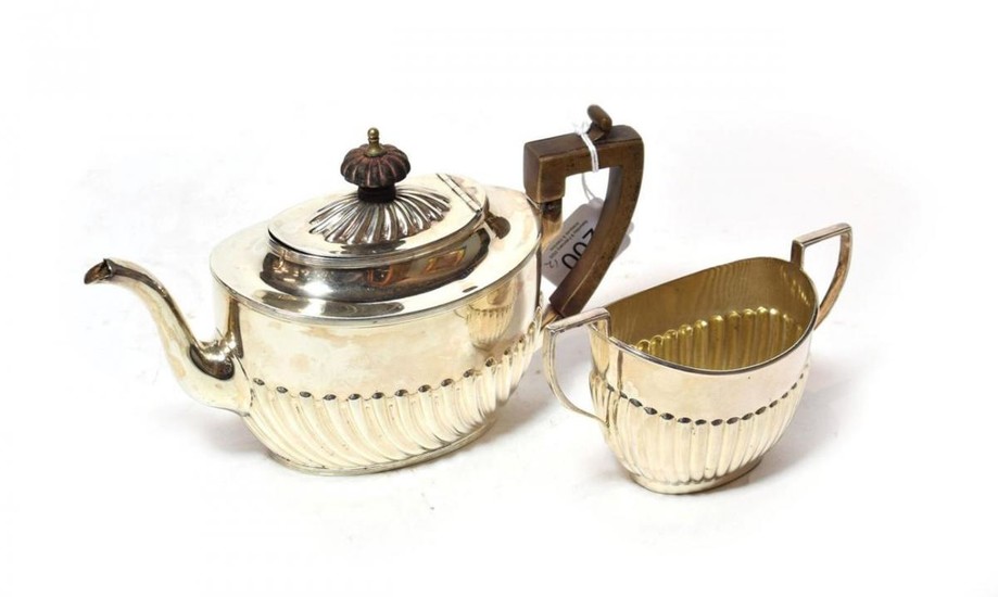 A Victorian silver teapot and a similar sugar-bowl, the teapot...