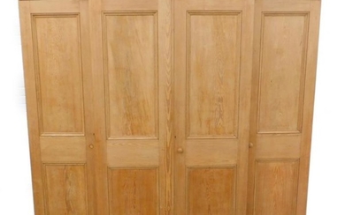 A Victorian stripped pine breakfront wardrobe, with two panelled...