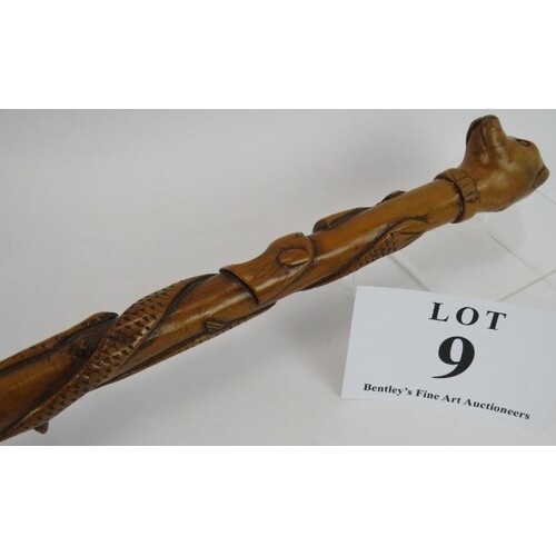 A beautifully carved Folk Art walking cane, probably blackth...
