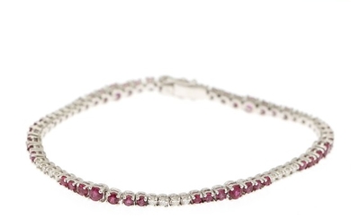 A bracelet set with numerous circular-cit rubies and brilliant-cut diamonds, mounted in 18k white gold. L. 17.5 cm.