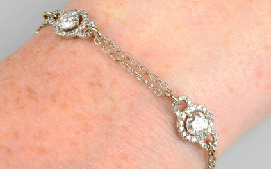 A brilliant-cut diamond cluster bracelet.